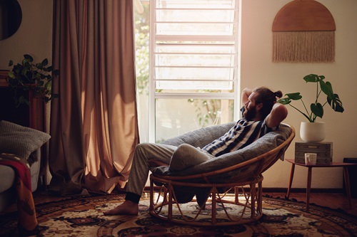 Man relaxing in a chair at home