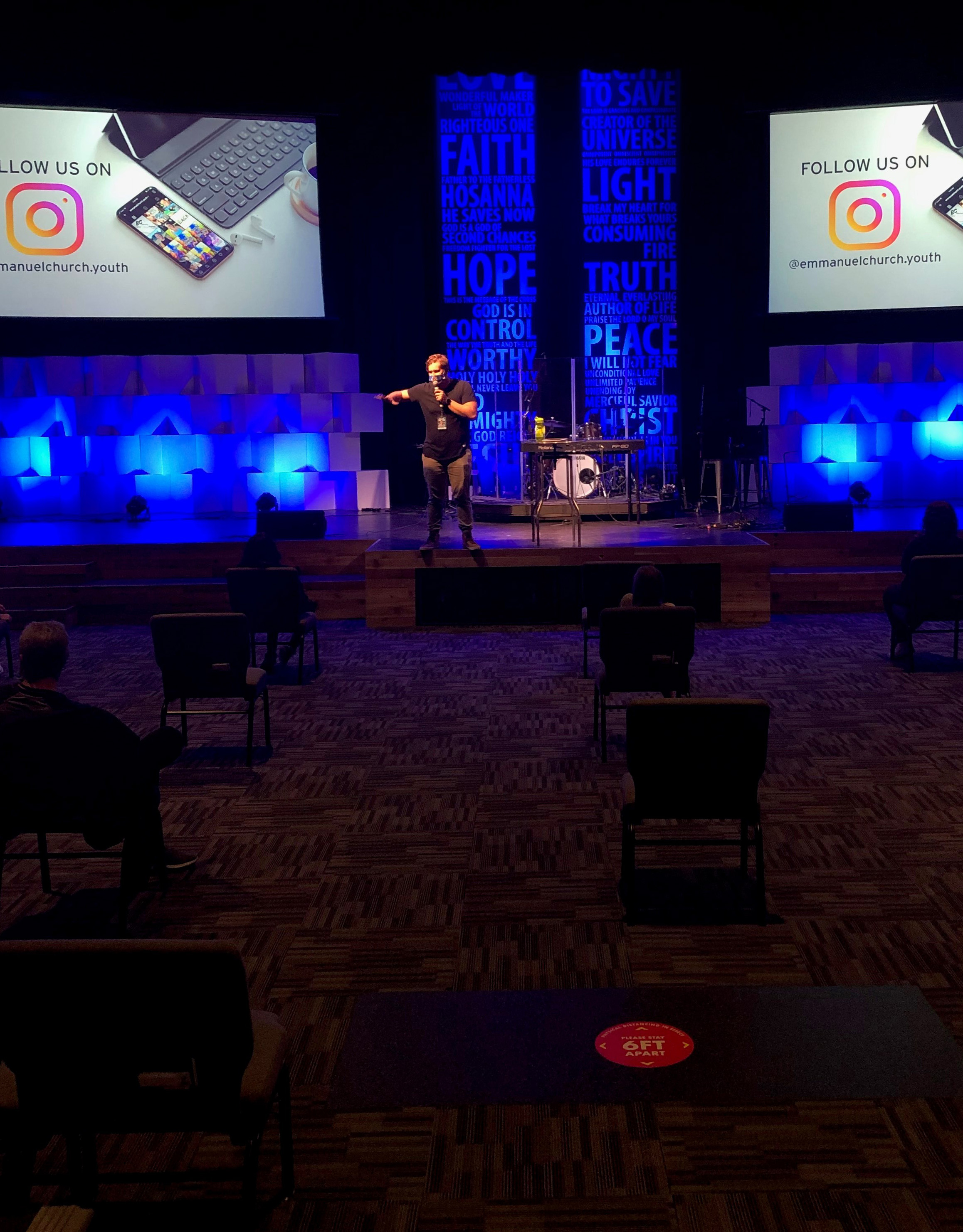 Caleb Bloch preaching a message to a socially distanced audience