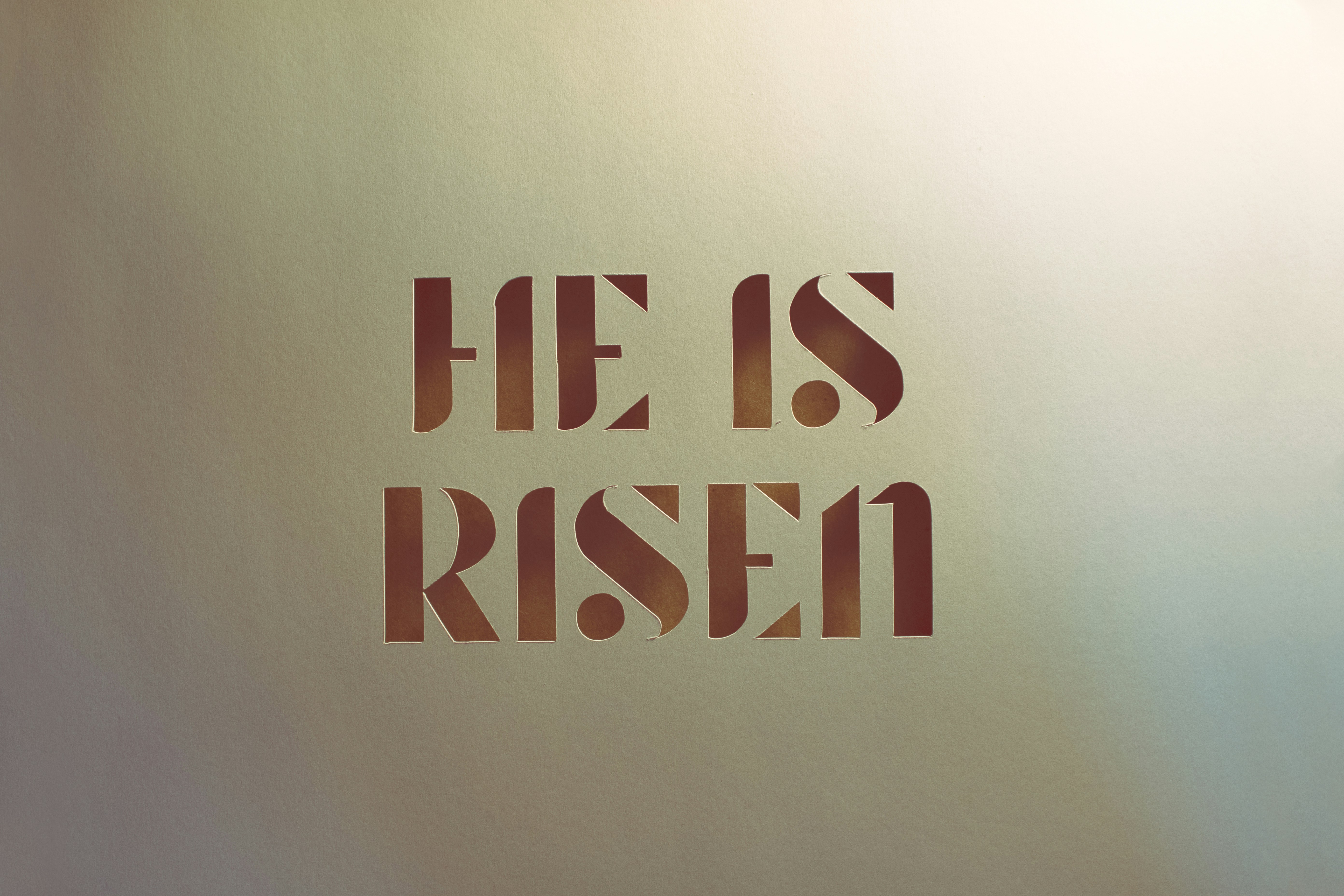 An image with the text 'He Is Risen'