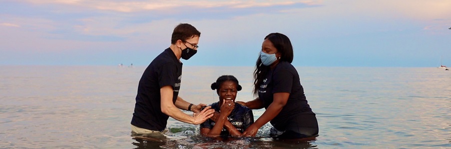 7 - Landing page - bottom photo - World Article - Mission Canada Ryerson Baptism Mission Canada workers baptize Ryerson student in Lake Ontario